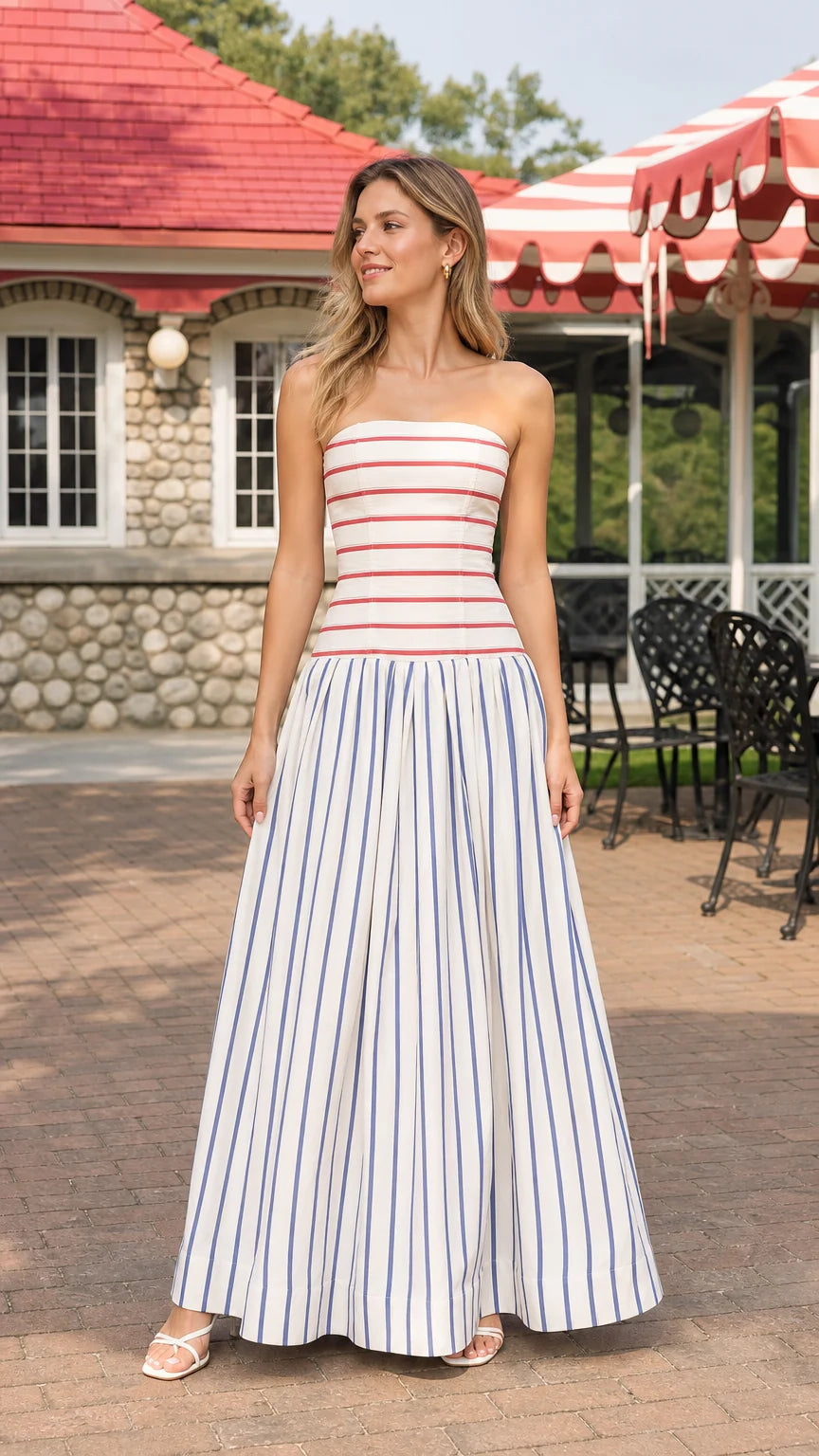 Model wearing blue and white striped strapless maxi dress, front view
