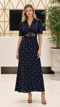 Front view of model wearing Navy Blue floral V-neck lace trim maxi dress