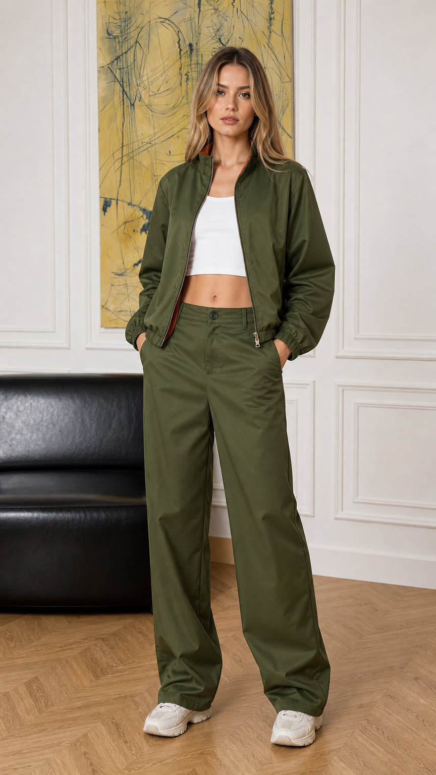 Full-body front view of woman wearing olive green bomber jacket and wide-leg pants set