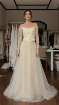 Front view of champagne beaded corset tulle evening gown