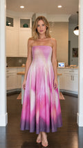 Front view of model wearing pink ombre smocked maxi dress