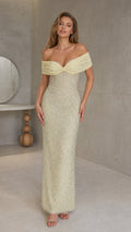 Model wearing yellow off-shoulder beaded evening gown, front view