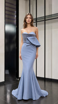 Front view of light blue strapless beaded peplum mermaid evening dress