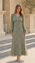 Model wearing sage green floral long sleeve maxi dress front view