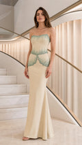 Front view of champagne strapless beaded mermaid evening gown