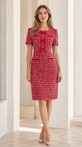 Front view of woman wearing Red short sleeve tweed sheath dress with bow details