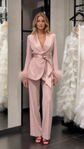 Model wearing pink satin feather cuff blazer and trousers set front view