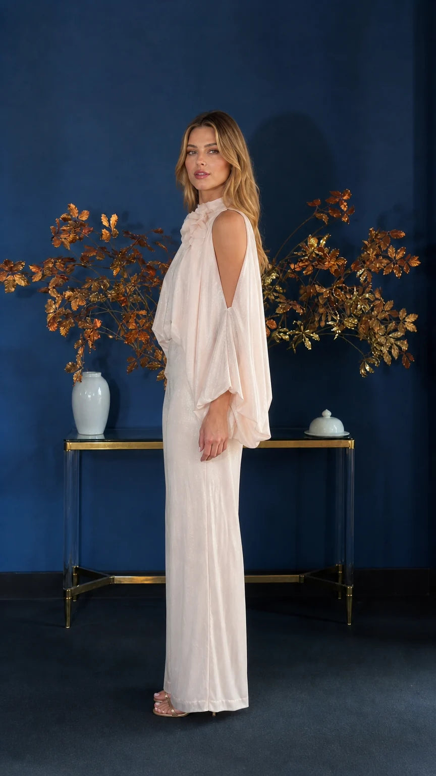 Side profile view of champagne jumpsuit showing wide leg silhouette