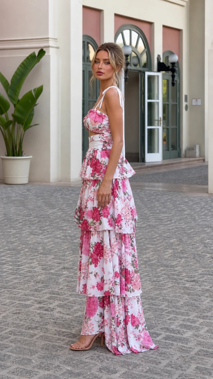 Side profile view of model in pink floral tiered maxi set