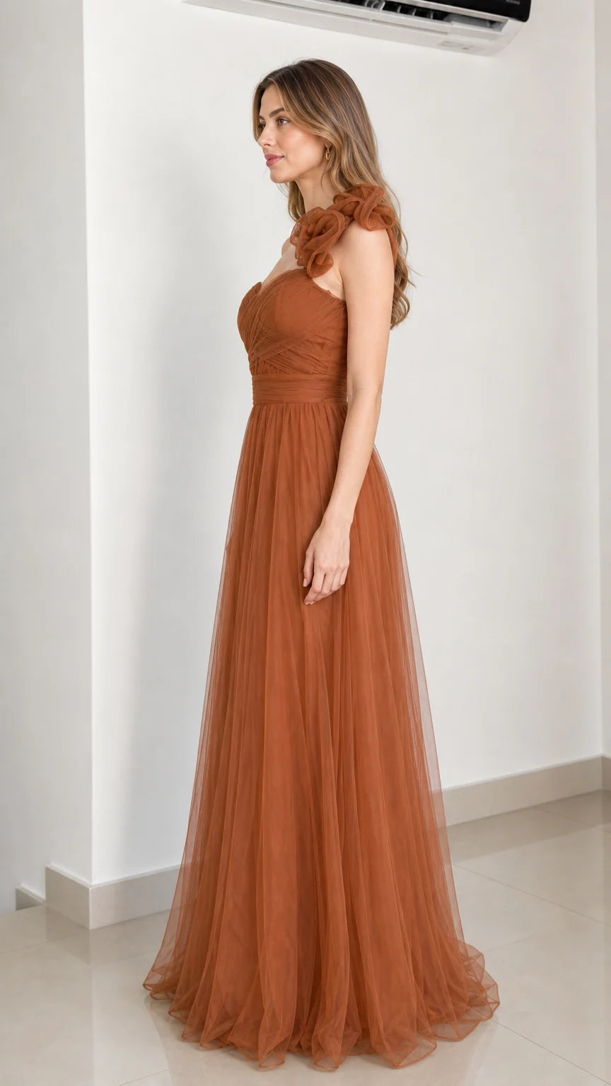 Side profile of rust brown tulle gown
