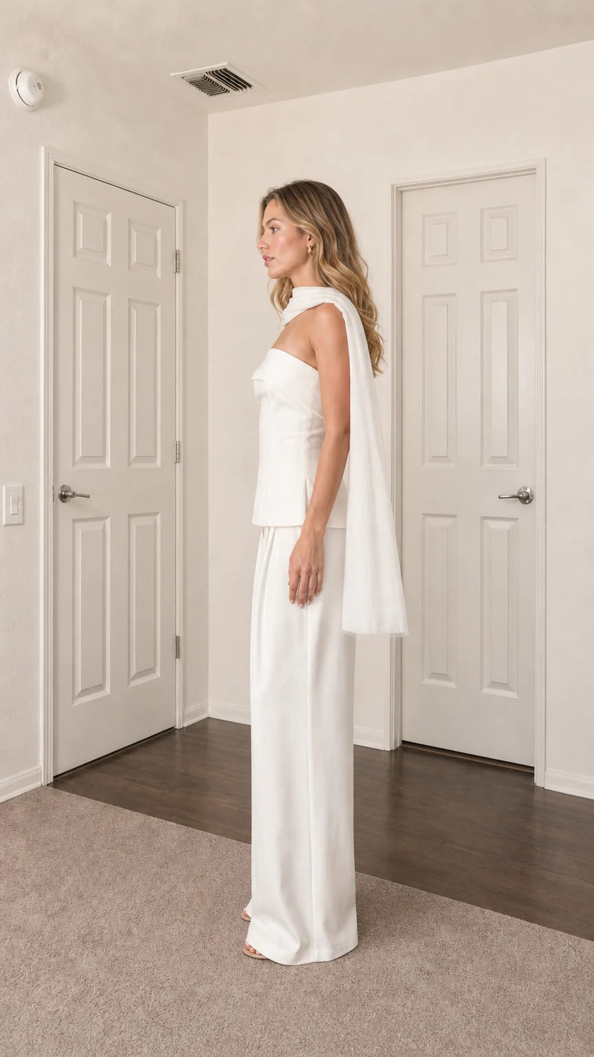 Side profile view of model in white two-piece set