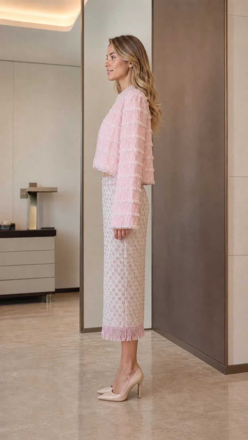 Model wearing pink tweed set side view