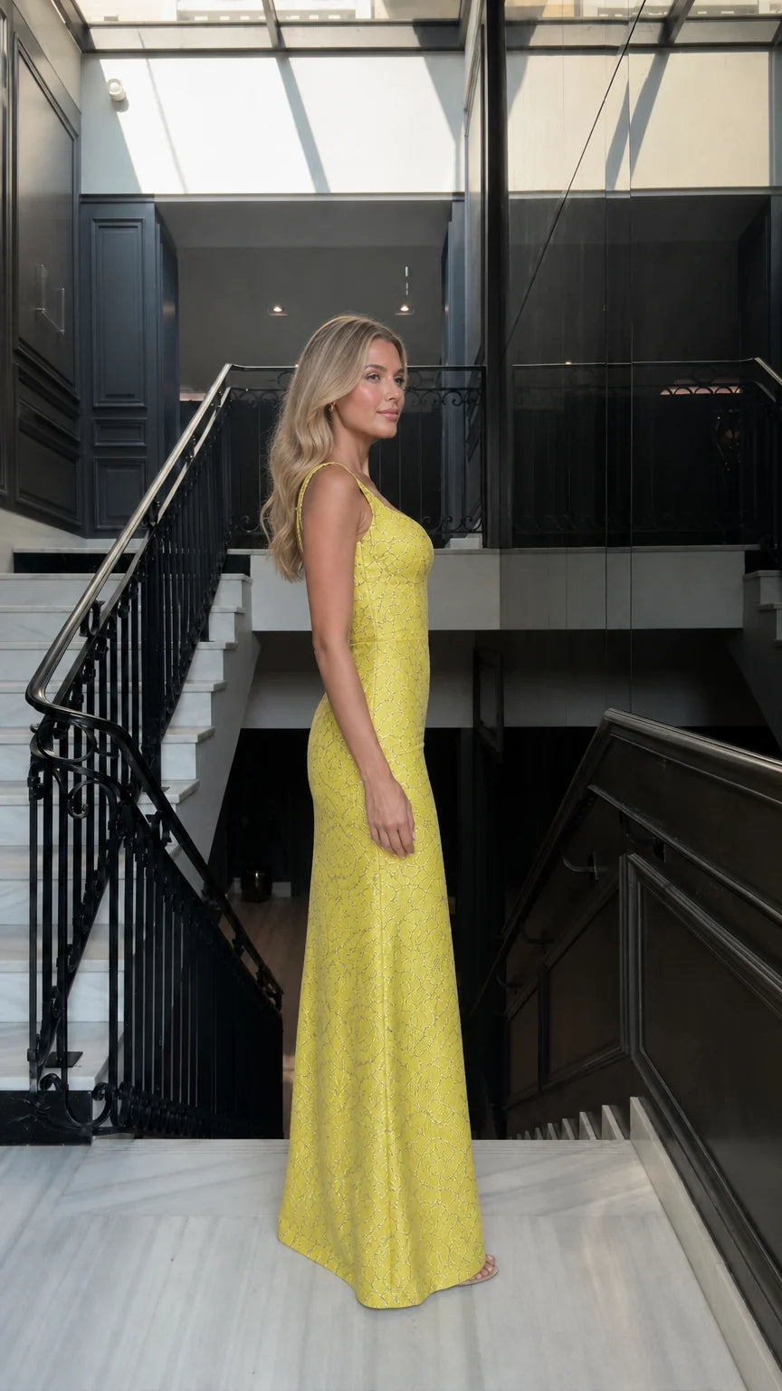Side profile view of yellow lace evening dress