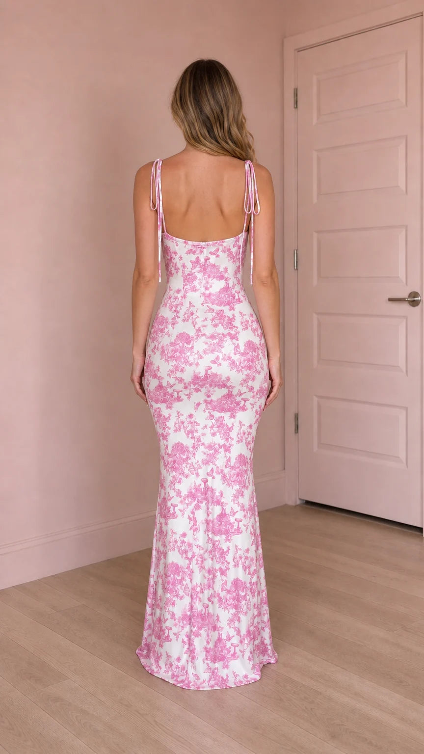 Back view of pink floral maxi dress showing tie straps