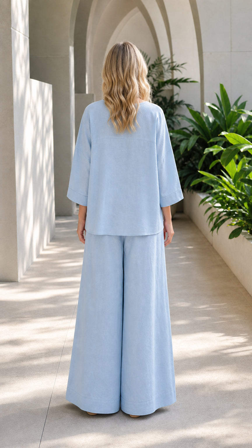 Back view of woman in light blue matching set