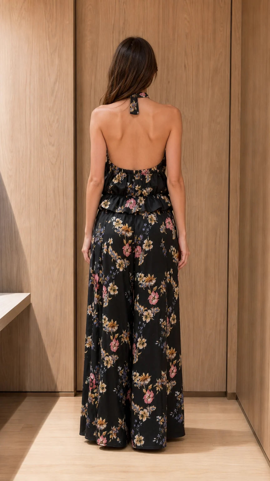 Back view of black floral halter top and wide-leg pants set