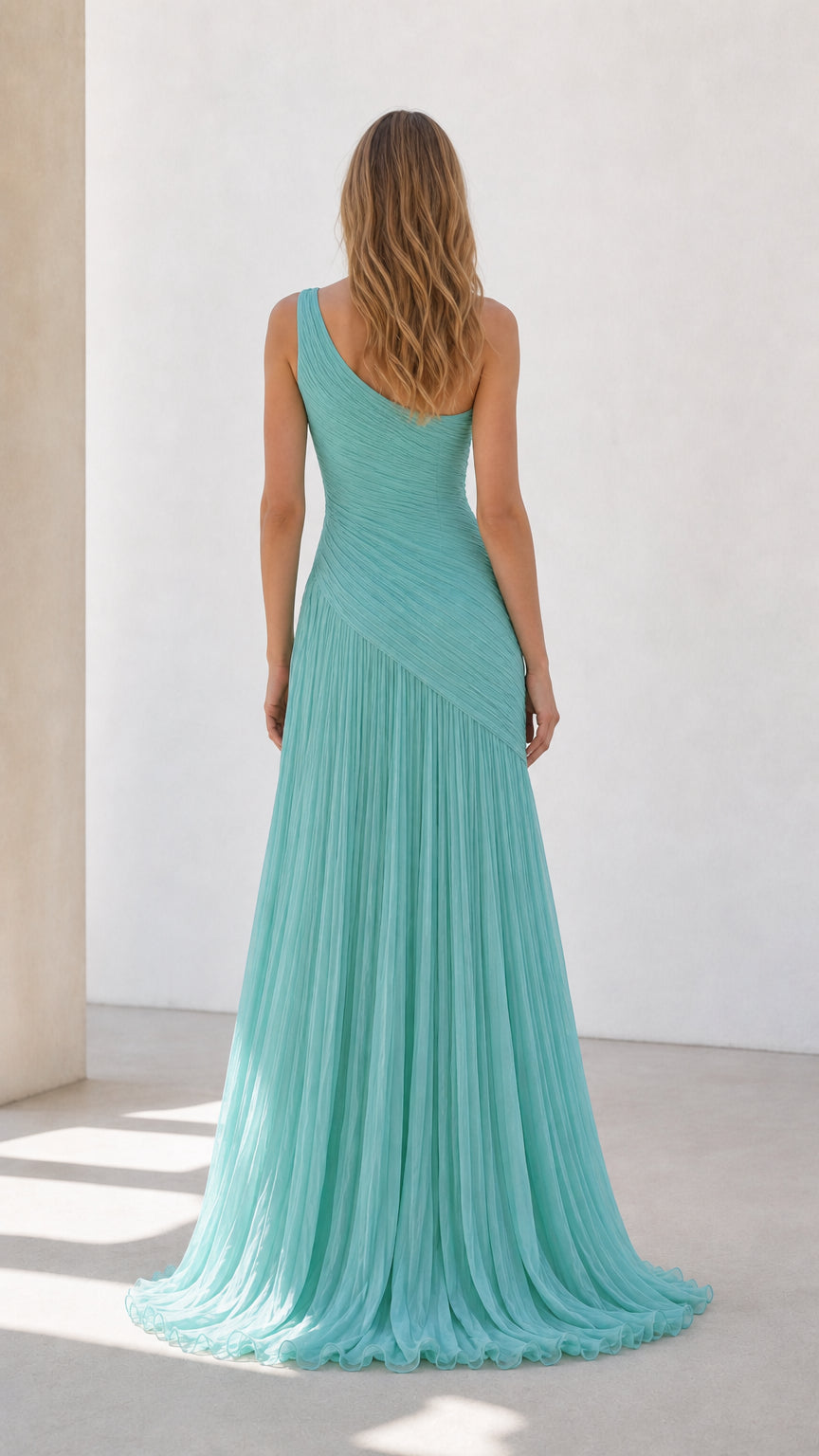Back view of aqua blue sleeveless pleated floor length gown