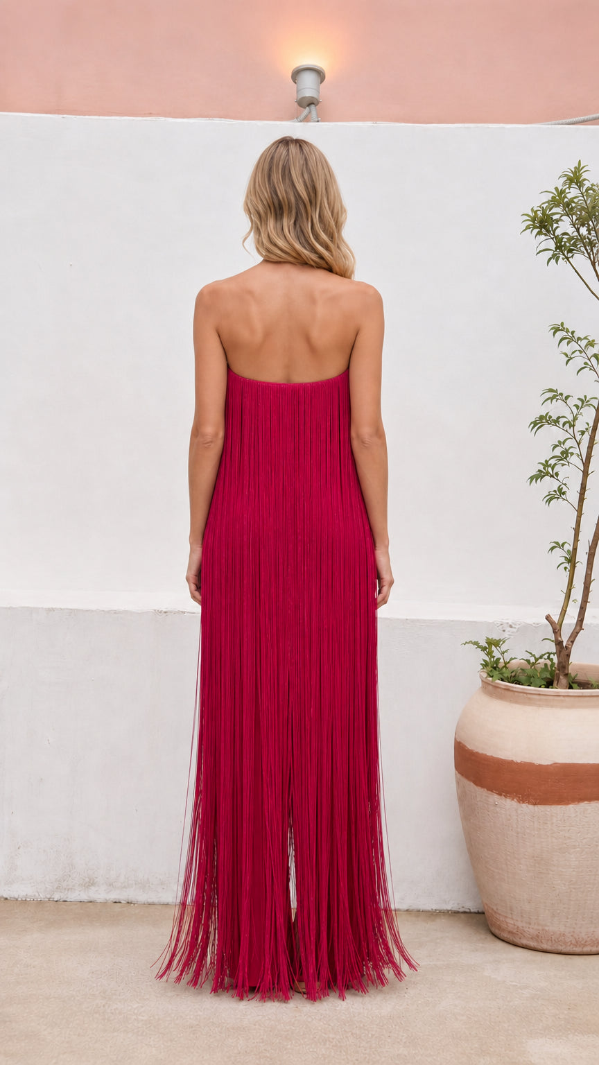 Back view of floor-length strapless fringe evening dress in magenta
