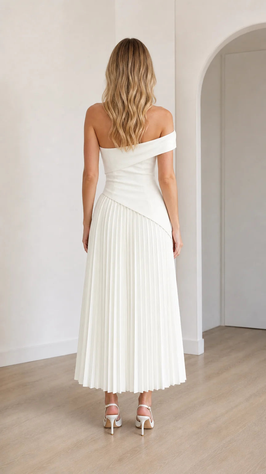 Back view of model in white off-shoulder midi dress