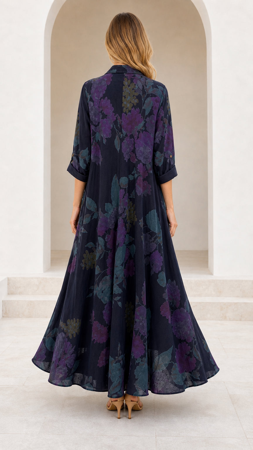 Back view of model in Navy Blue floral print maxi dress