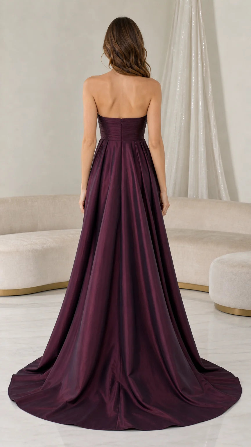 Back view of formal dress showing long train and clean lines