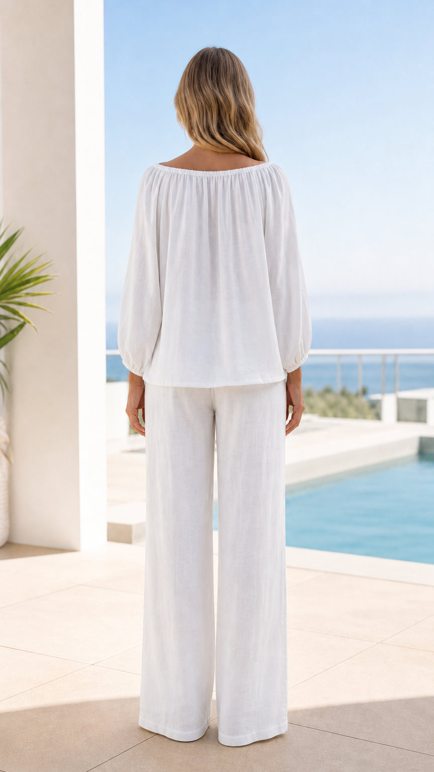 Back view of woman in white two-piece resort wear