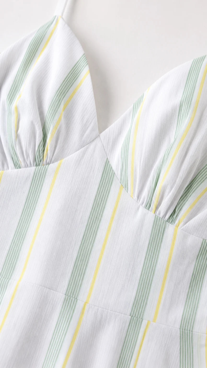 Close-up detail of the gathered bodice and vertical stripe pattern