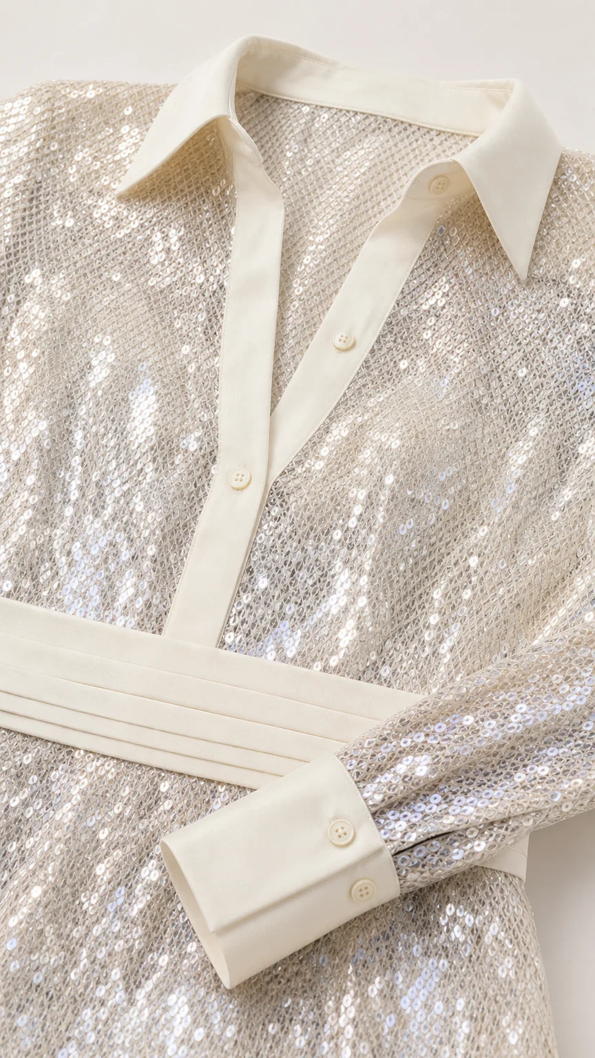 Close-up detail of shirt collar, buttons, and sequin texture