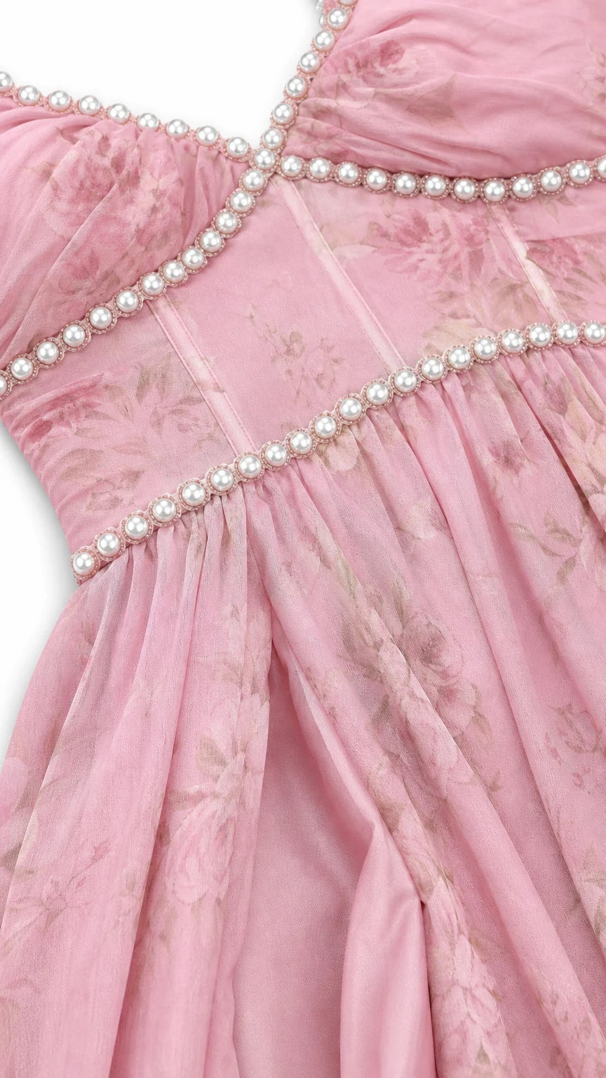 Close-up detail of faux pearl beading on bodice and neckline of pink dress