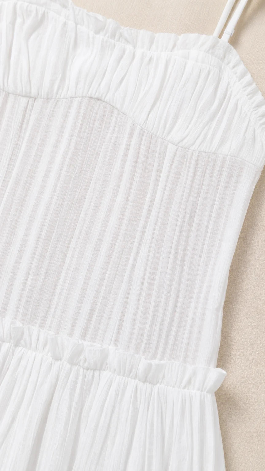 Close-up detail of White pleated bodice and straps