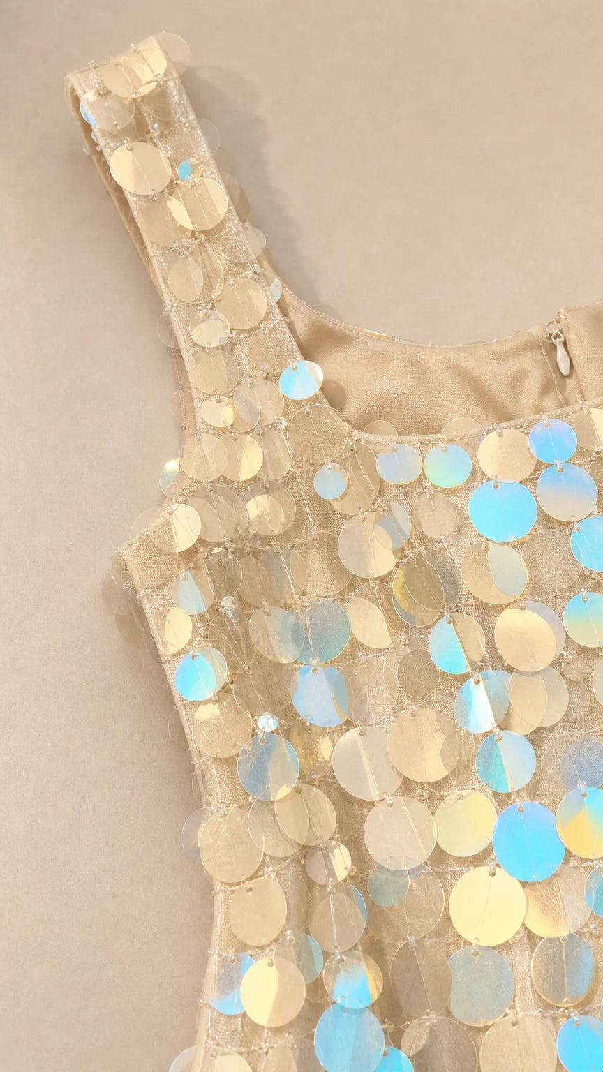 Close-up detail of square neckline and iridescent sequins