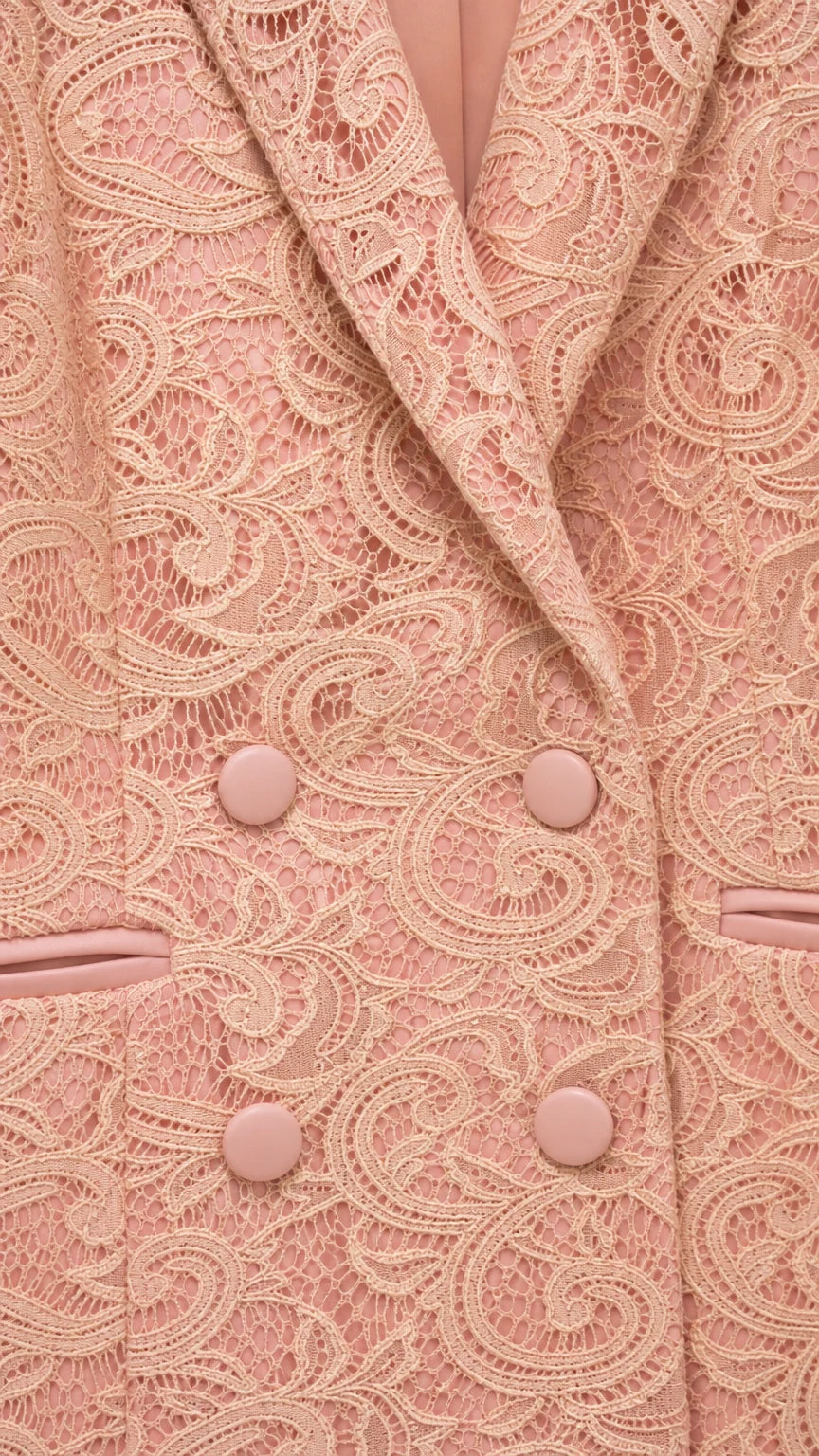 Close up of apricot lace blazer lapel and buttons