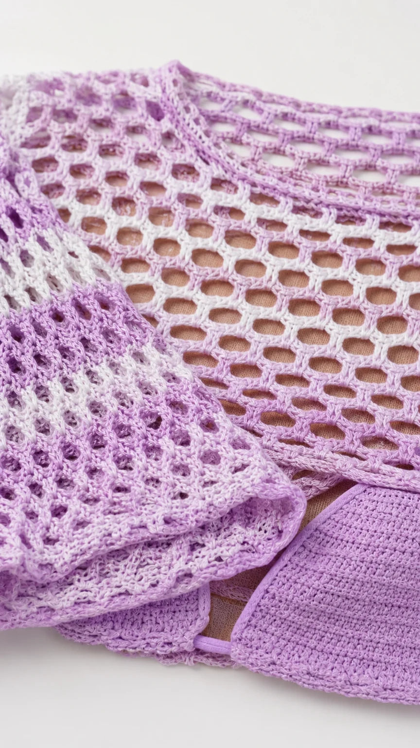Close-up detail of purple open knit texture