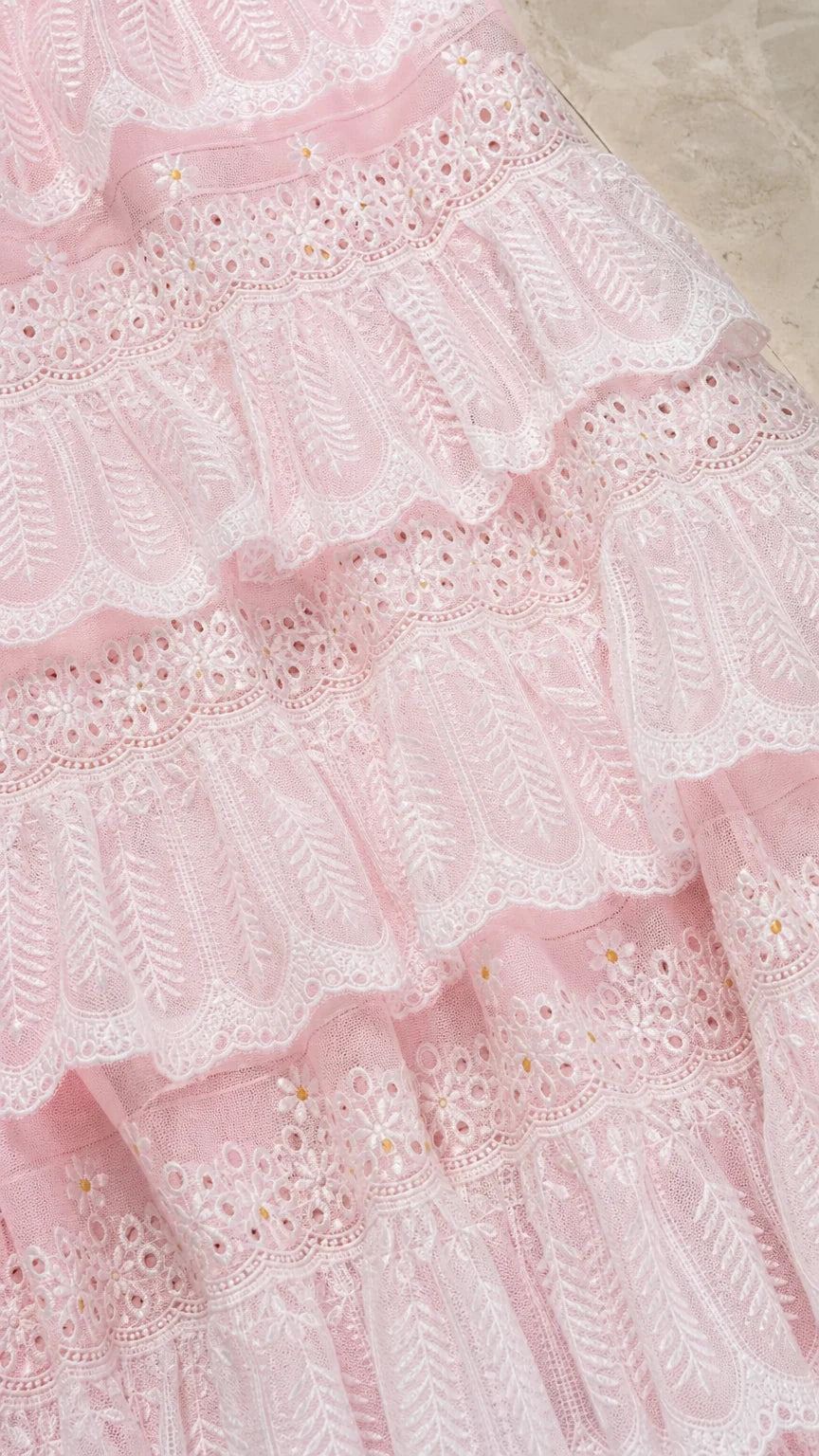 Close up texture view of pink tiered lace fabric