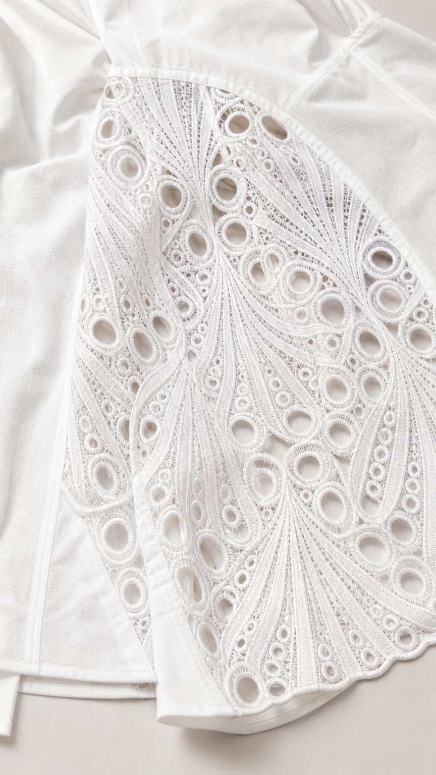 Close up texture shot of the white geometric lace panel