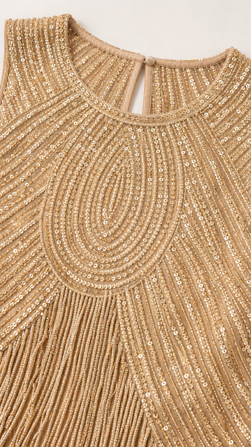 Close-up detail of Champagne Gold concentric sequin neckline and beaded fringe