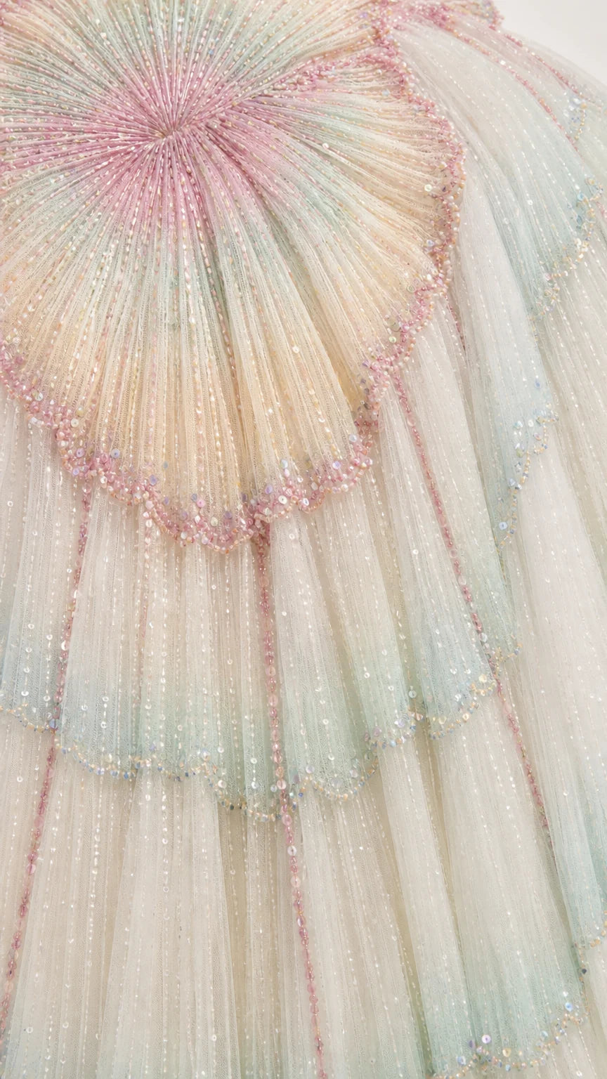 Close-up detail of intricate beadwork and tulle pleating
