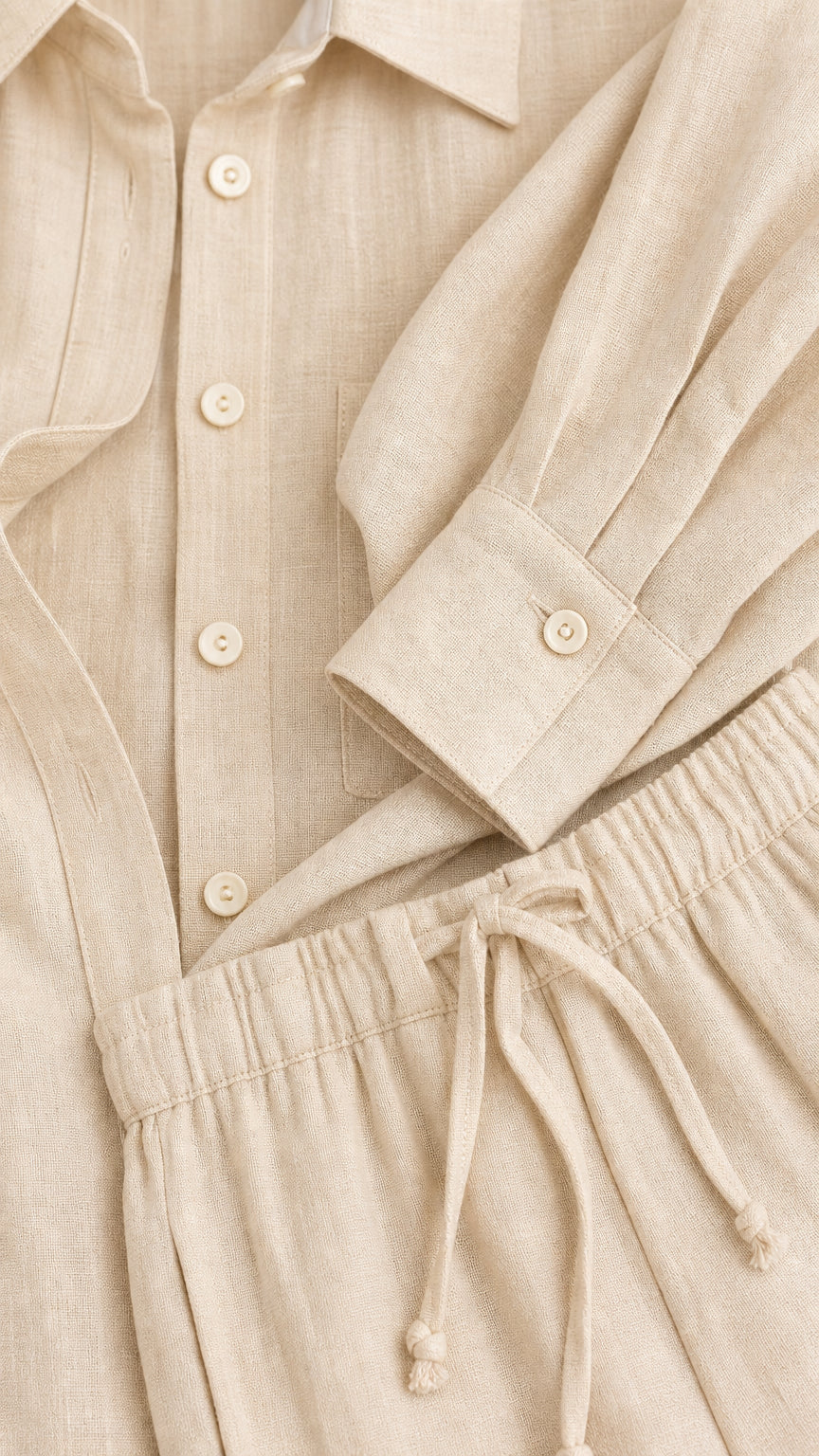 Close-up detail of beige button-down shirt cuff and drawstring pant waistband