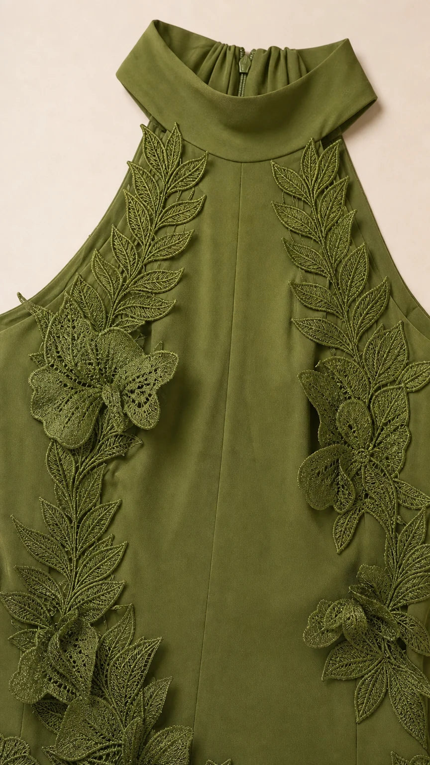 Close-up detail of halter neckline and 3D leaf appliques in olive