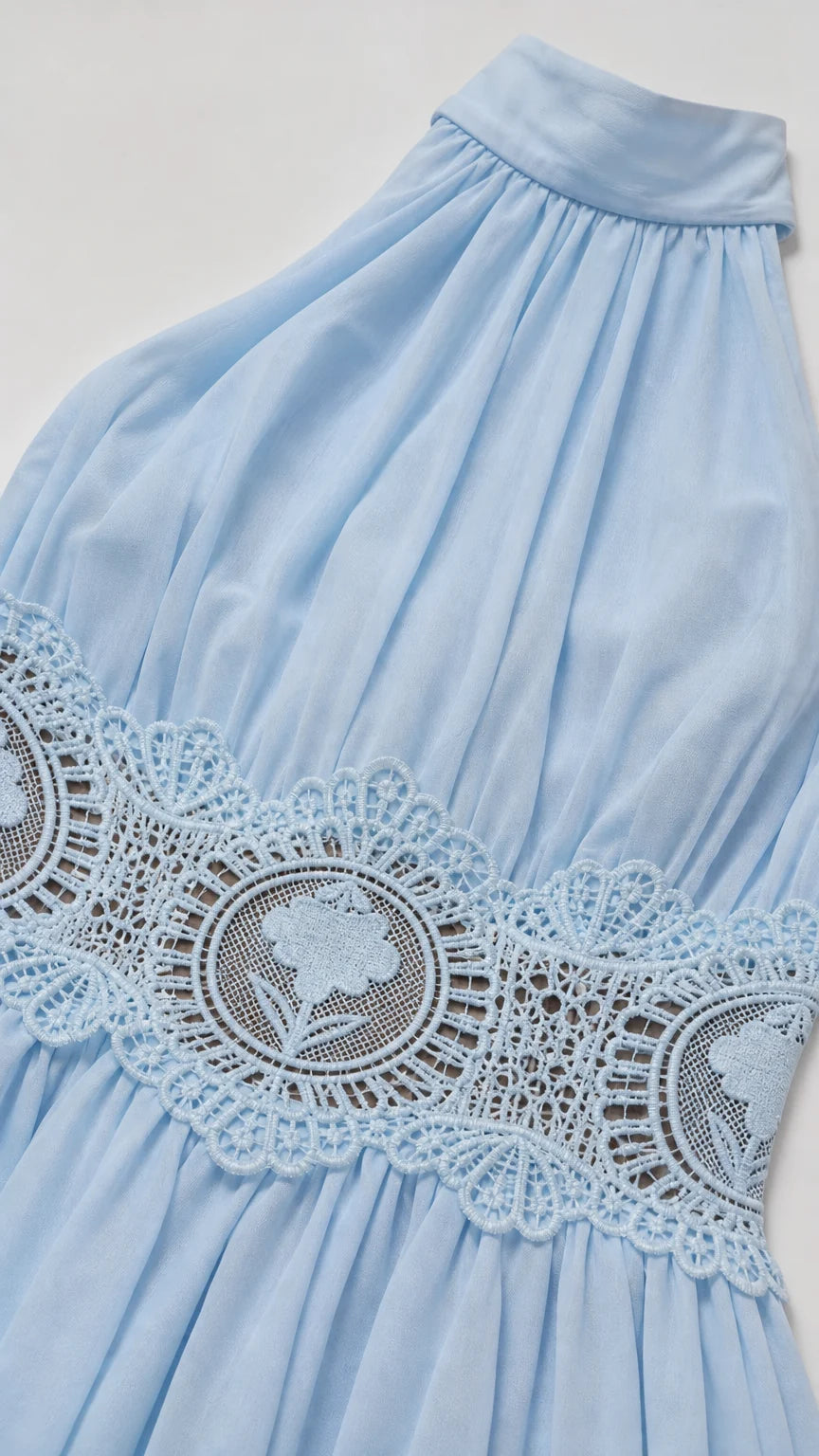 Close-up of fabric texture and floral crochet waist