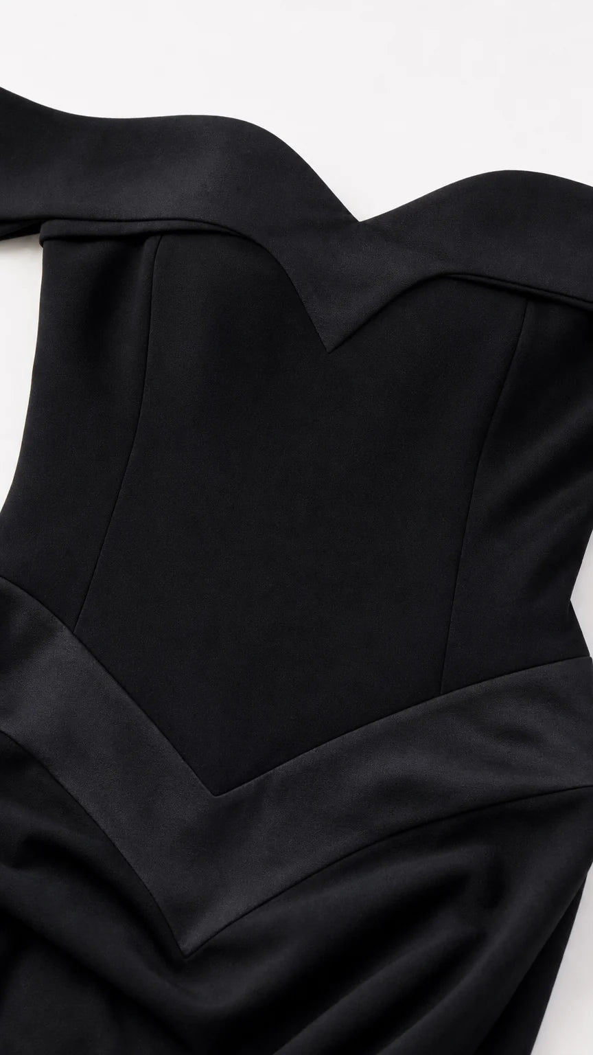 Close-up detail of black off-the-shoulder sweetheart neckline and bodice