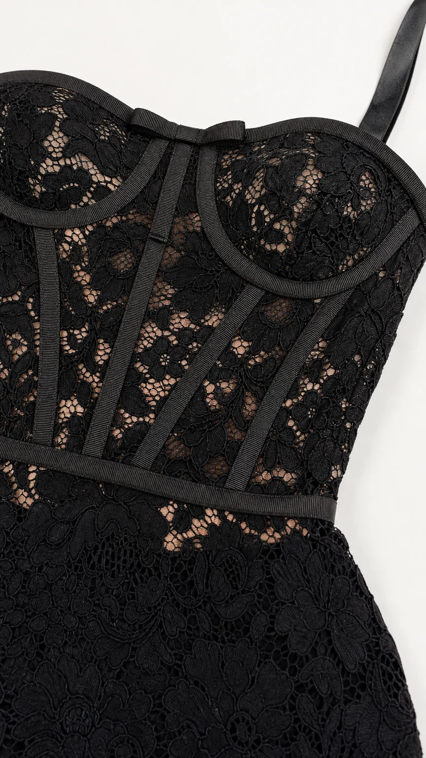 Close-up detail of structured corset bodice and floral lace