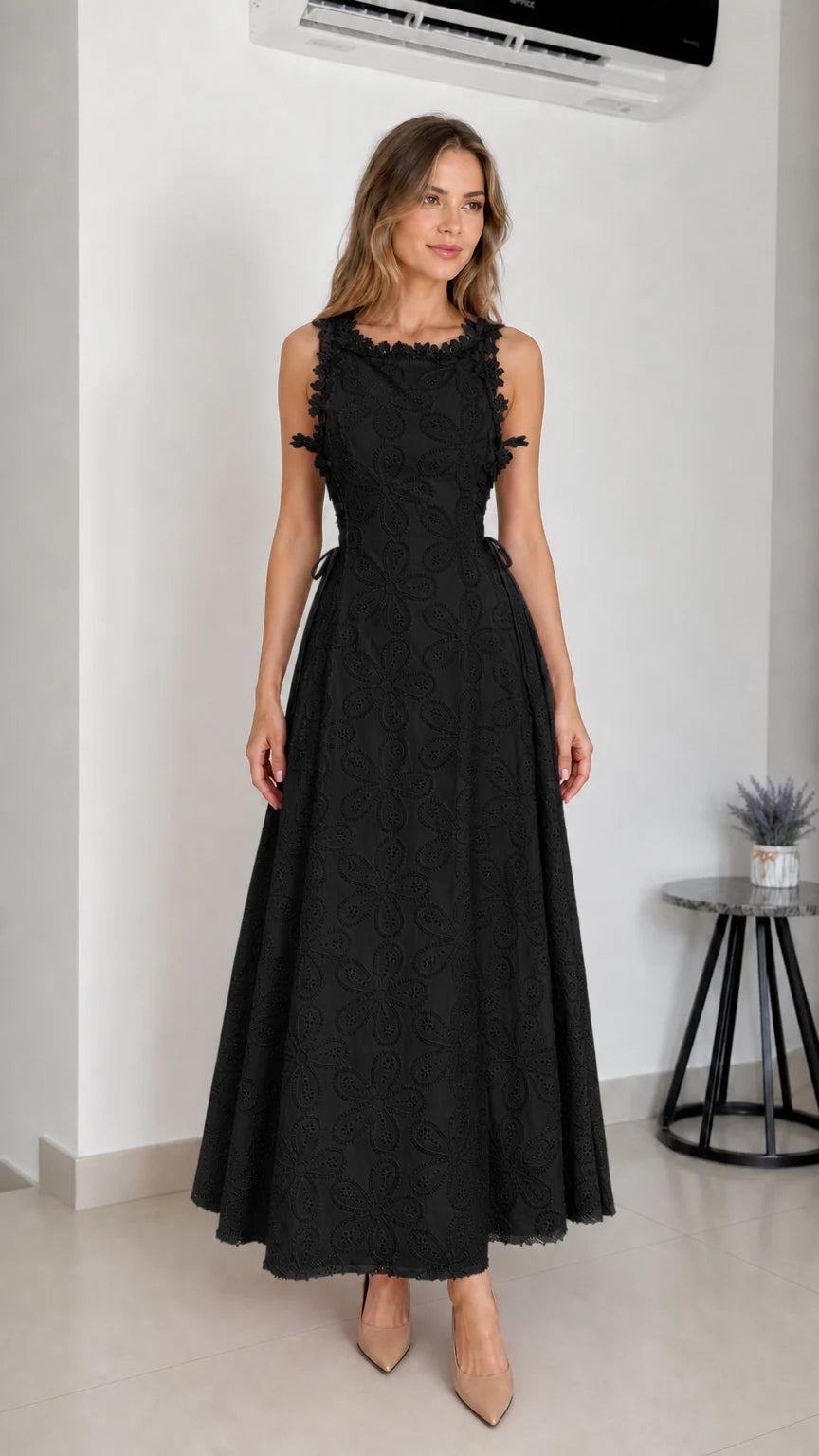 Model wearing black embroidered eyelet maxi dress
