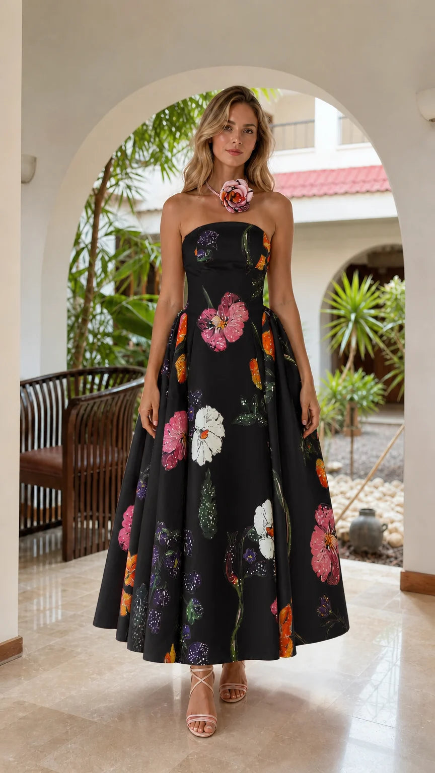 Model wearing black floral strapless midi dress