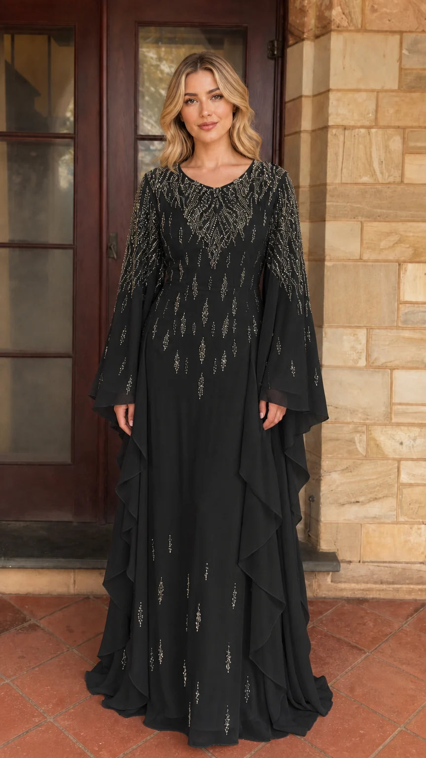 Model wearing black beaded long sleeve maxi dress