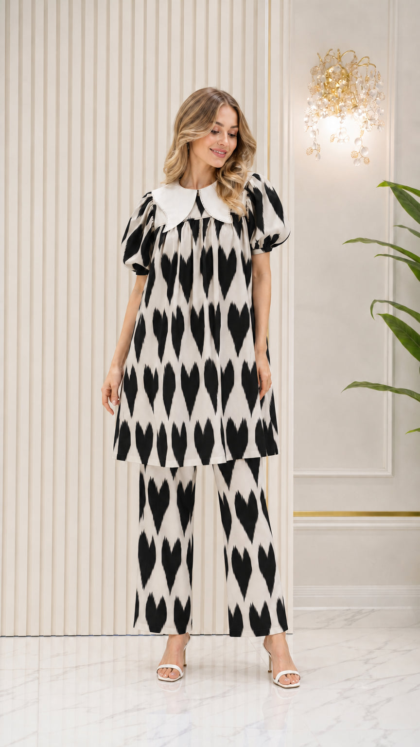 Model wearing Black and white geometric print tunic and pants set