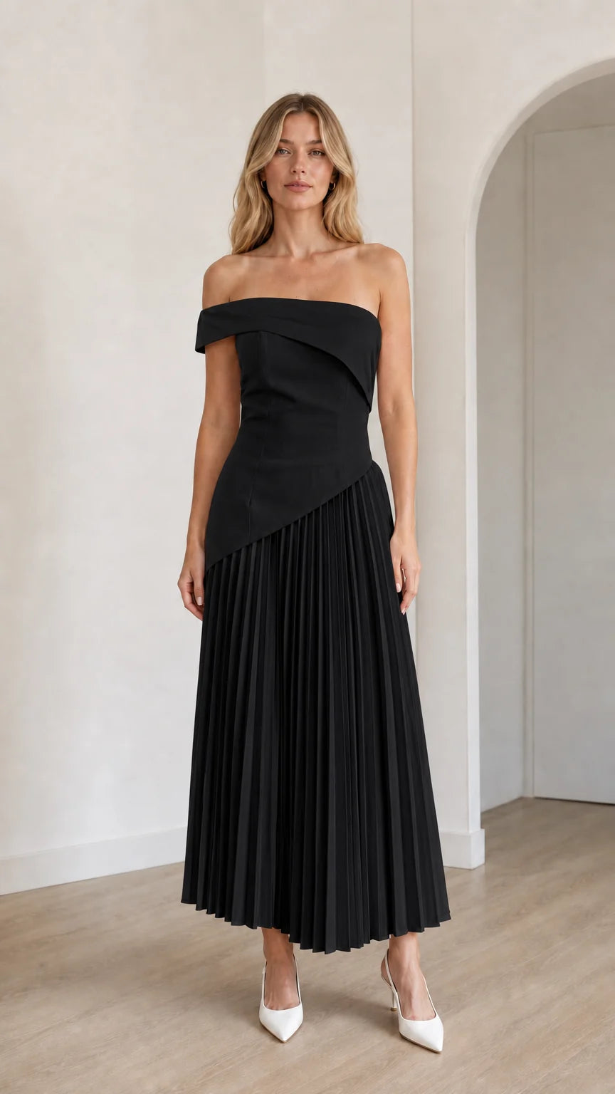 Model wearing black off-shoulder asymmetric pleated midi dress