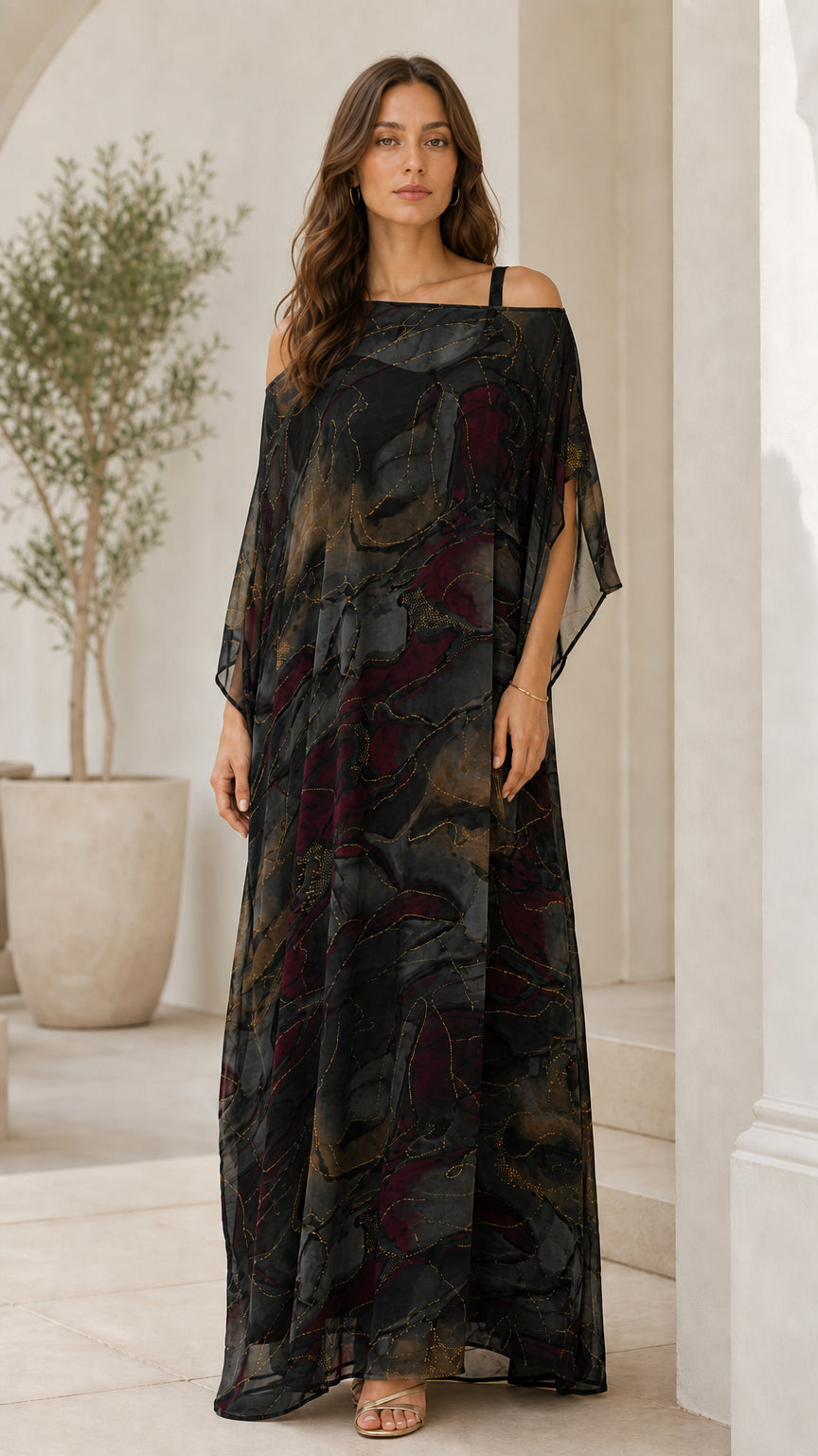 Woman wearing black abstract watercolor print cold-shoulder maxi dress