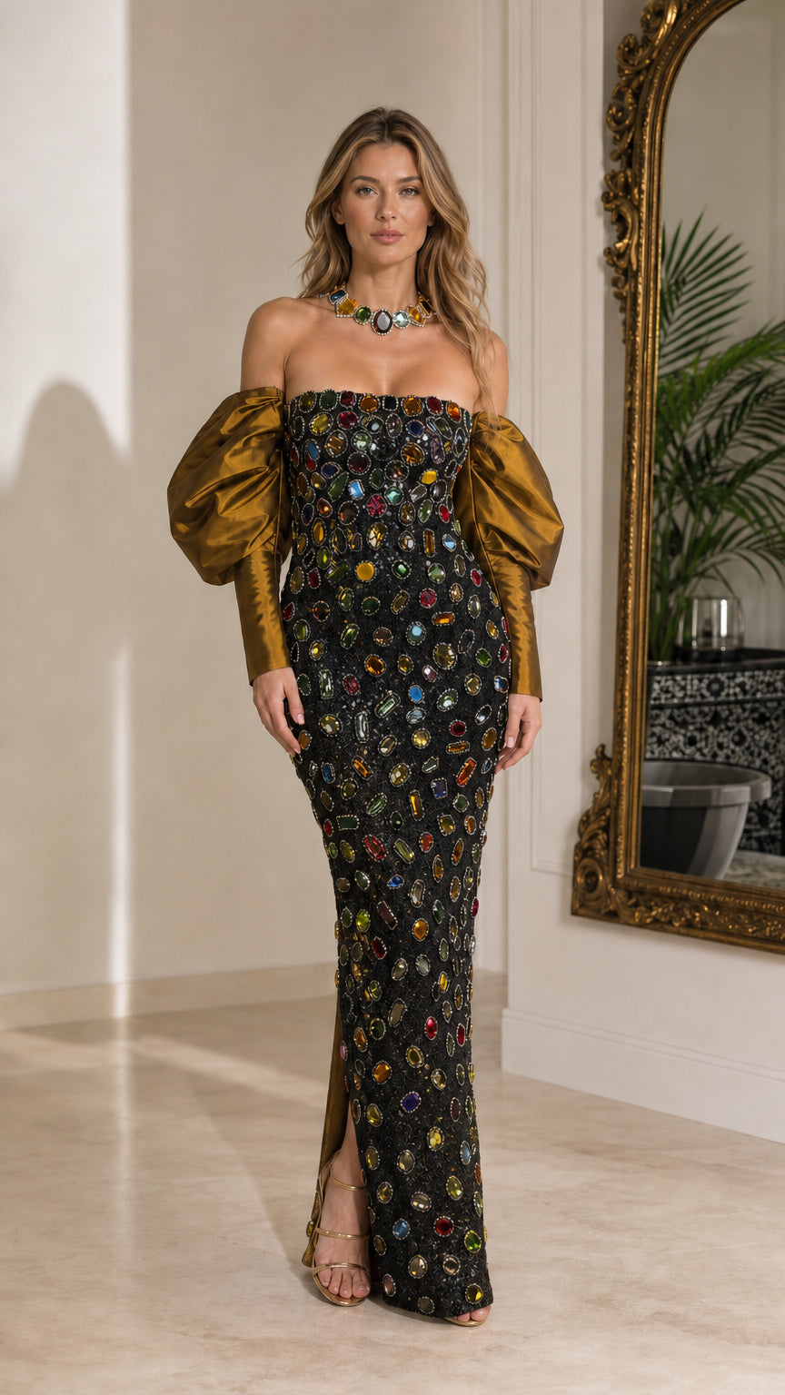 Full-length view of black off-the-shoulder crystal embellished evening gown with bronze puff sleeves