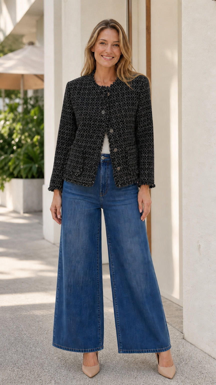 Model wearing black fringe-trim tweed jacket